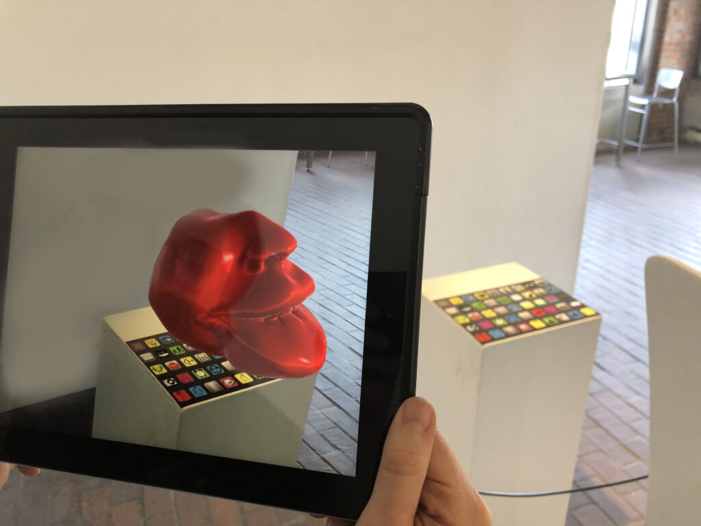 Augmented reality art piece viewed on a tablet in an exhibit
