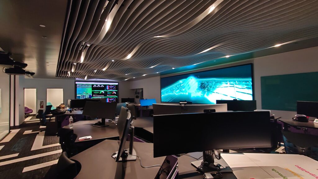 Executive briefing room with a large interactive display wall