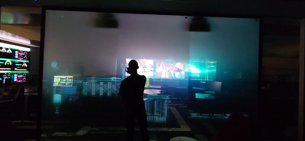 Visitor exploring a wall-sized touchscreen at Florida Power and Light PDROC
